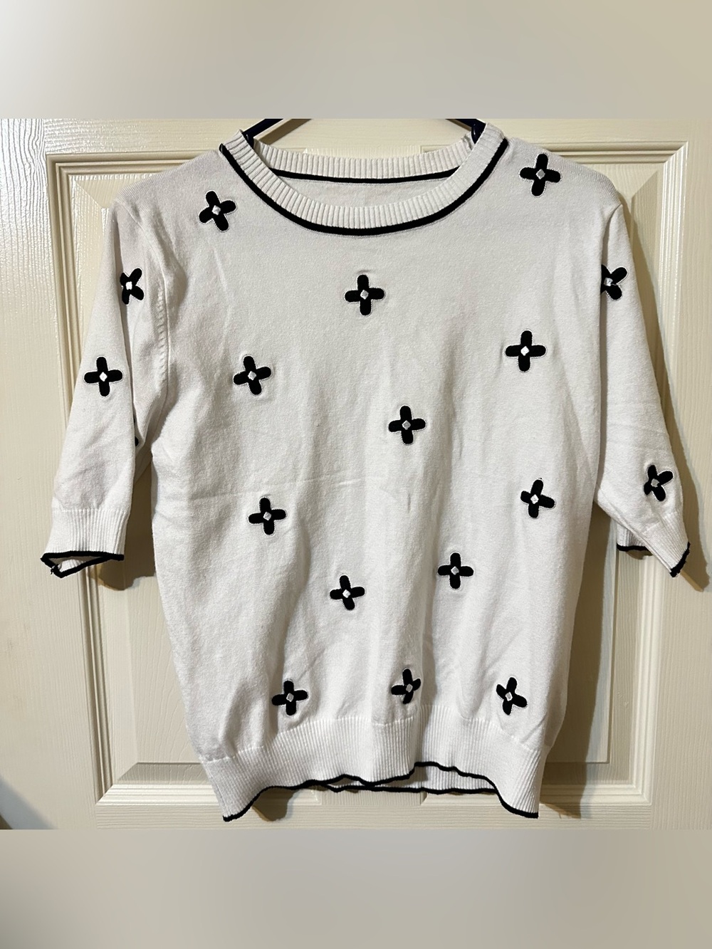 SHEIN White Crewneck Sweater with Black Floral Appliqué